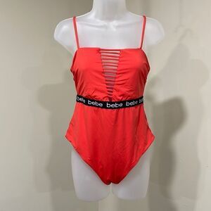 Bebe orange one piece swim suit. Size 10 M medium